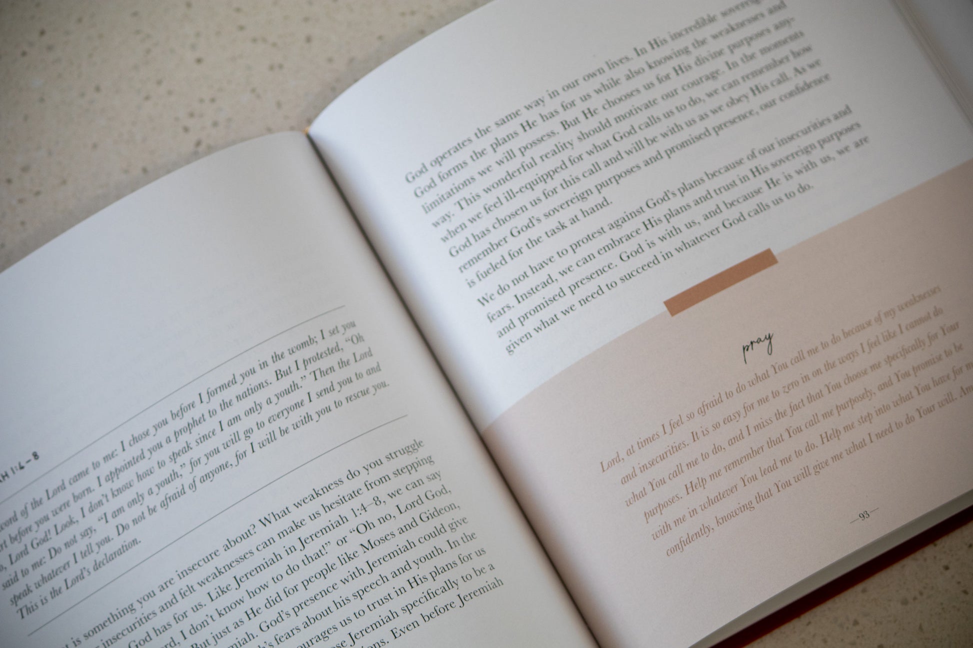 Open book with text on a textured surface