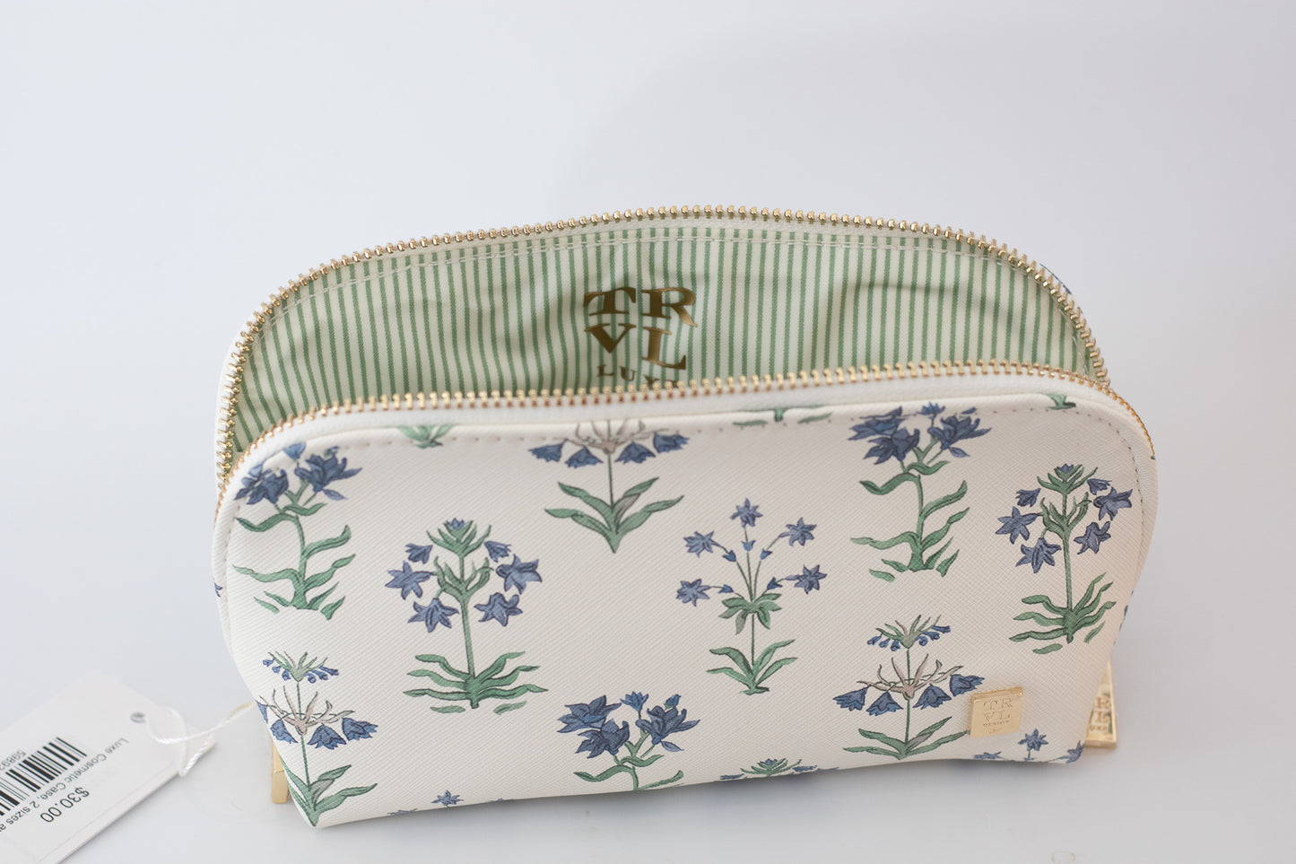 Floral-patterned pouch with green striped zipper on a light gray background