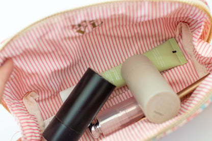 Cosmetic products on a striped fabric background