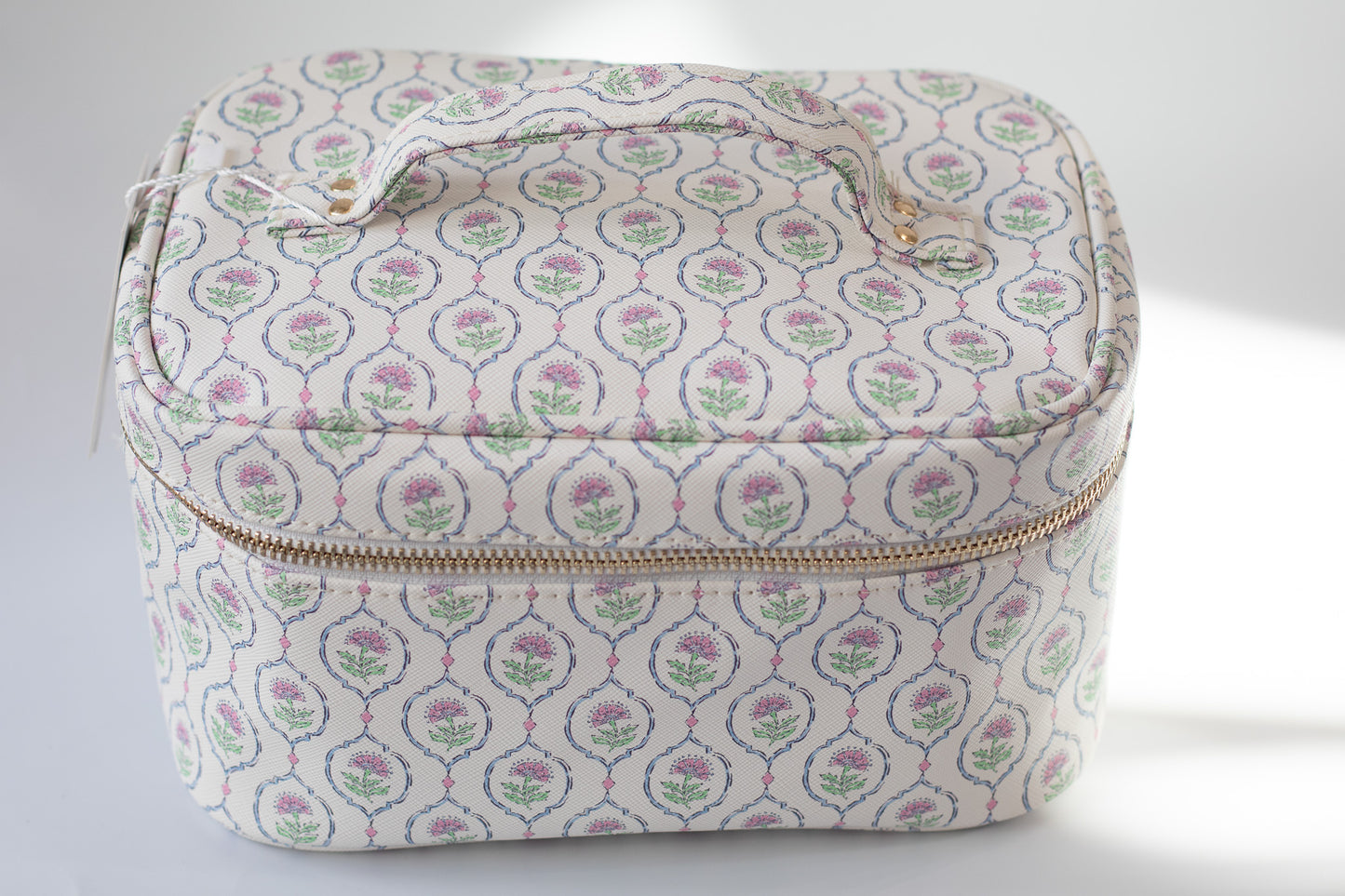 Patterned fabric case with a zipper on a white background