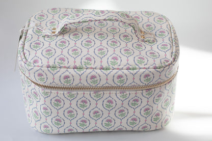 Patterned fabric case with a zipper on a white background