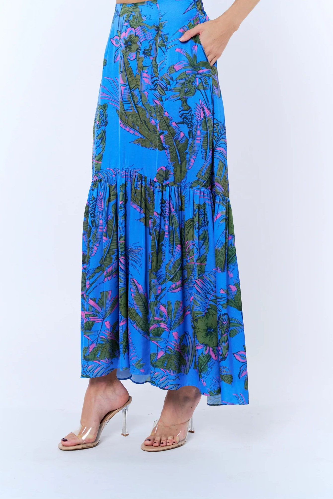 Person wearing a blue floral dress on a white background
