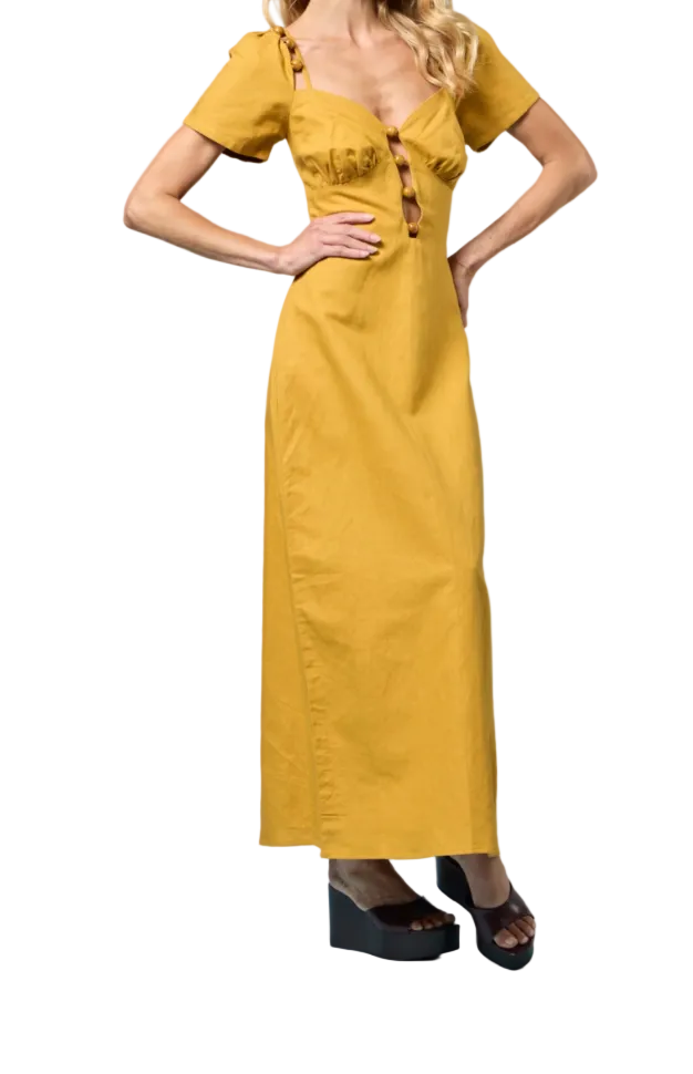 Woman wearing a yellow dress against a white background