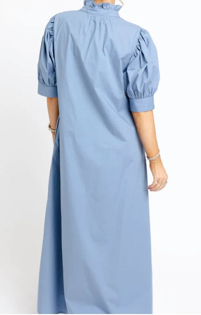 A light blue midi dress with puff sleeves and a high ruffled collar, shown from the back on a model against a white background.