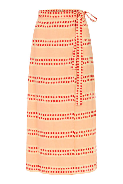 Striped wrap skirt with red and white pattern on a peach background