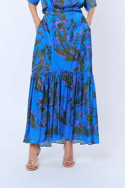 Woman wearing a blue floral dress on a white background