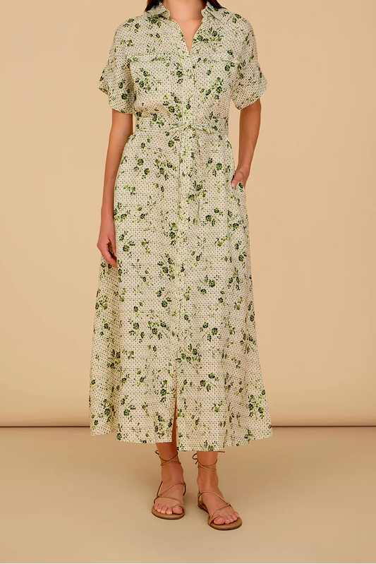 Woman wearing a floral dress against a beige background