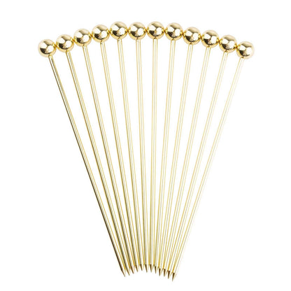 Set of gold hairpins on a white background