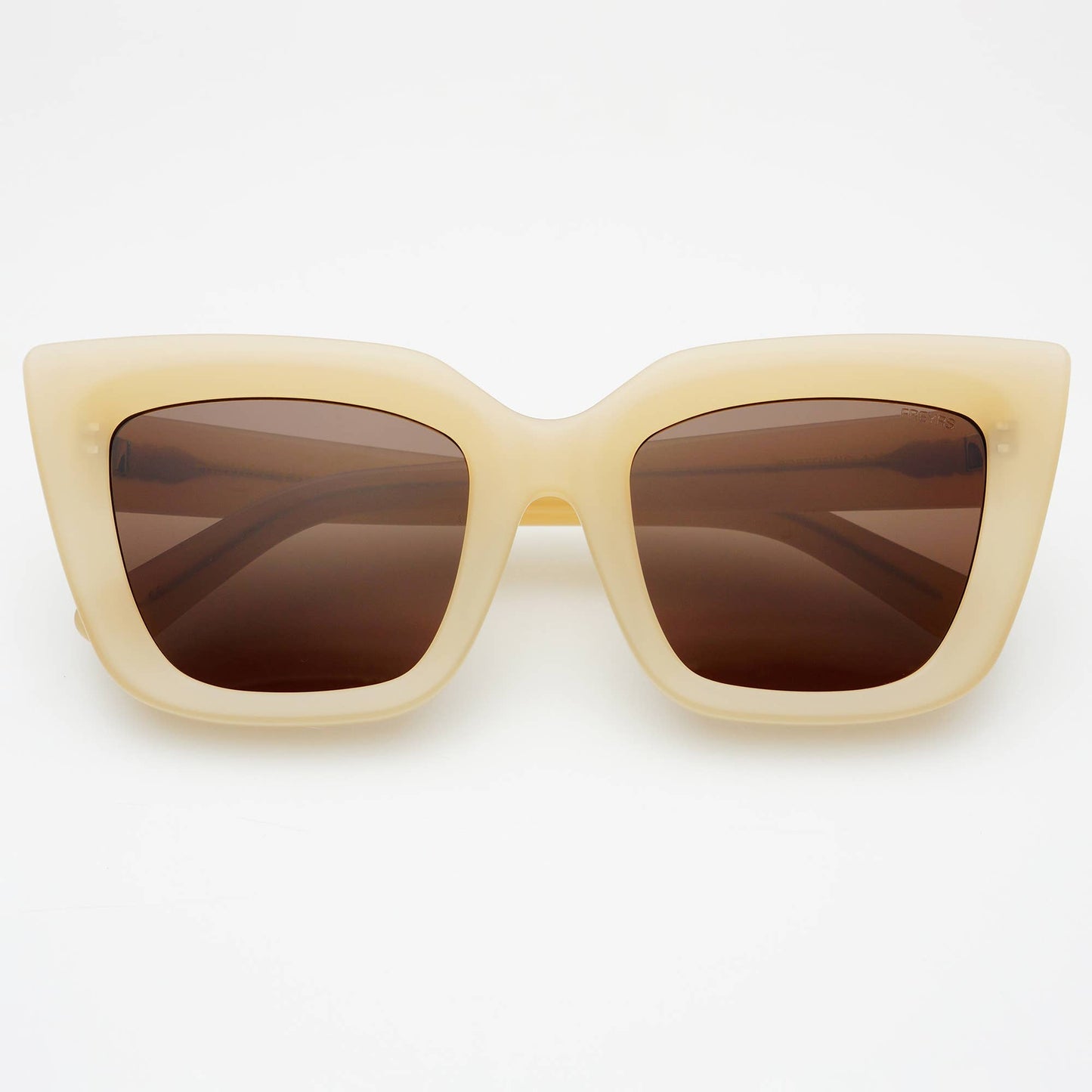 Beige sunglasses with brown lenses on a white background