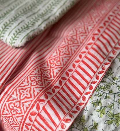 Close-up of patterned fabric with red and white design