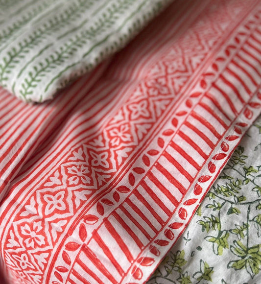 Close-up of patterned fabric with red and white design