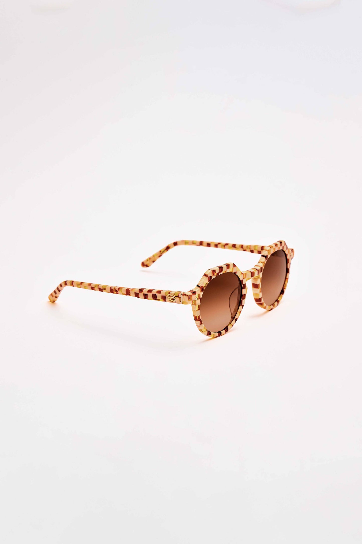 Sunglasses with a leopard print frame on a white background
