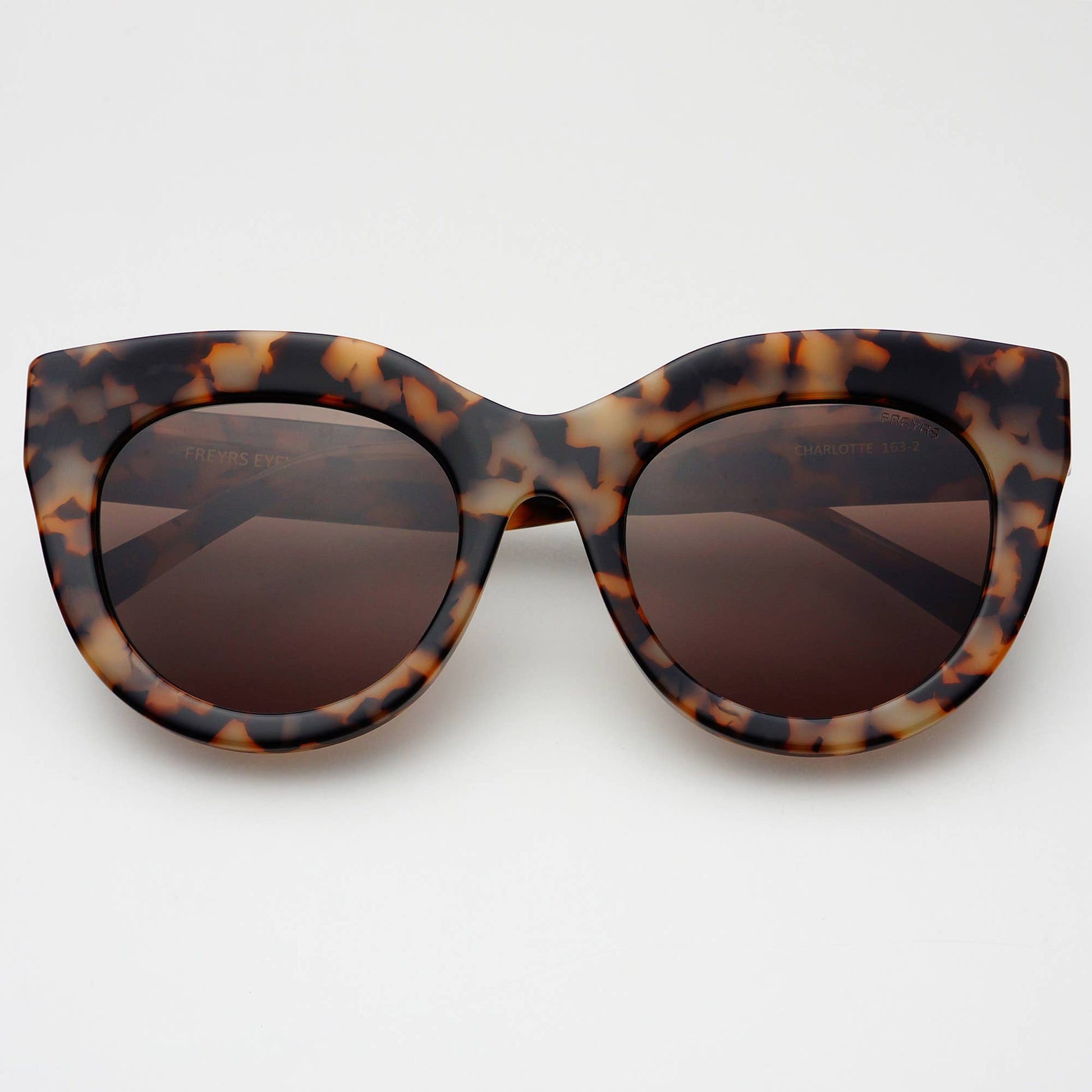 Tortoiseshell cat-eye sunglasses on a white background