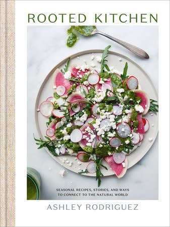 Book cover of 'Rooted Kitchen' with a salad on a plate
