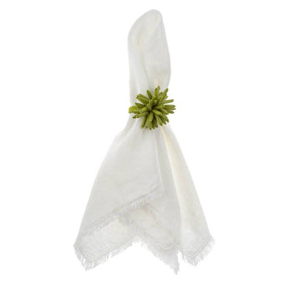 White napkin with a green decorative element on a white background