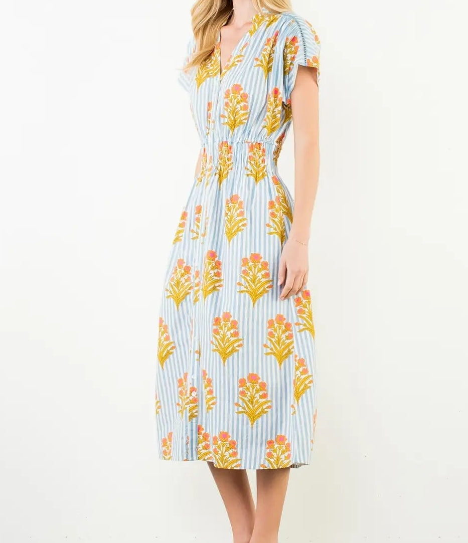 Woman wearing a floral dress with a white background