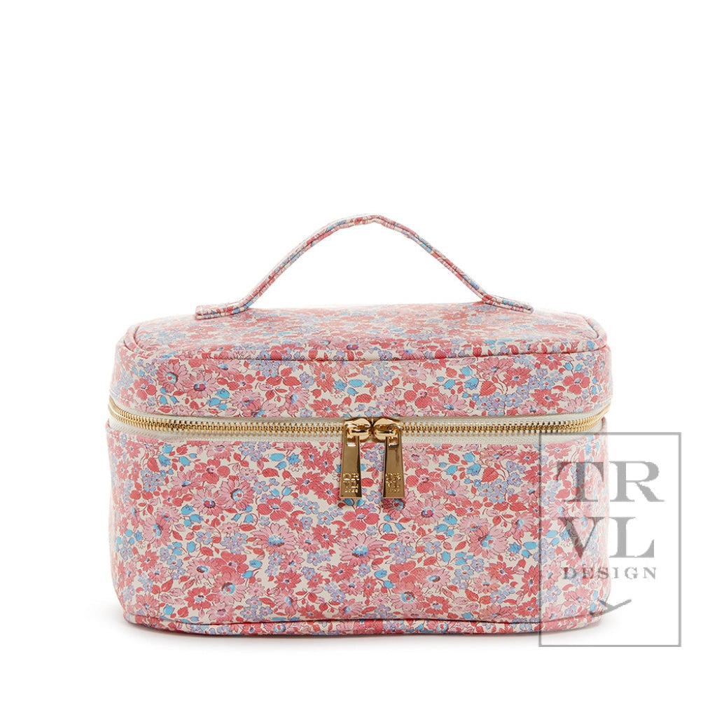 Floral patterned travel case with gold zipper on a white background