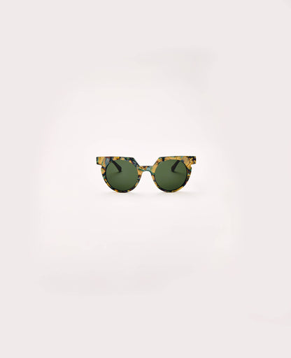 Round sunglasses with tortoiseshell frame and green lenses on a white background