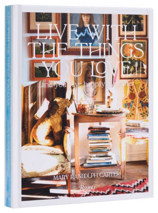 Book cover with interior design theme and text 'Live with the things you love', featuring a room with furniture and decor.