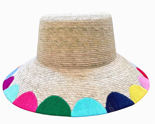 Beige straw hat with colorful scalloped edge on a white background
