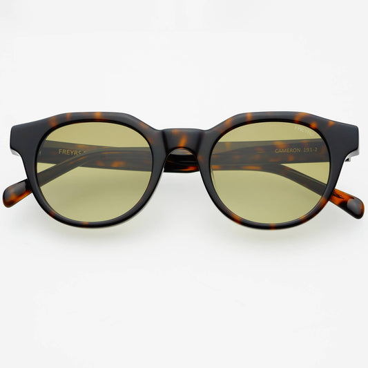 Sunglasses with tortoiseshell frame and gold lenses on a white background