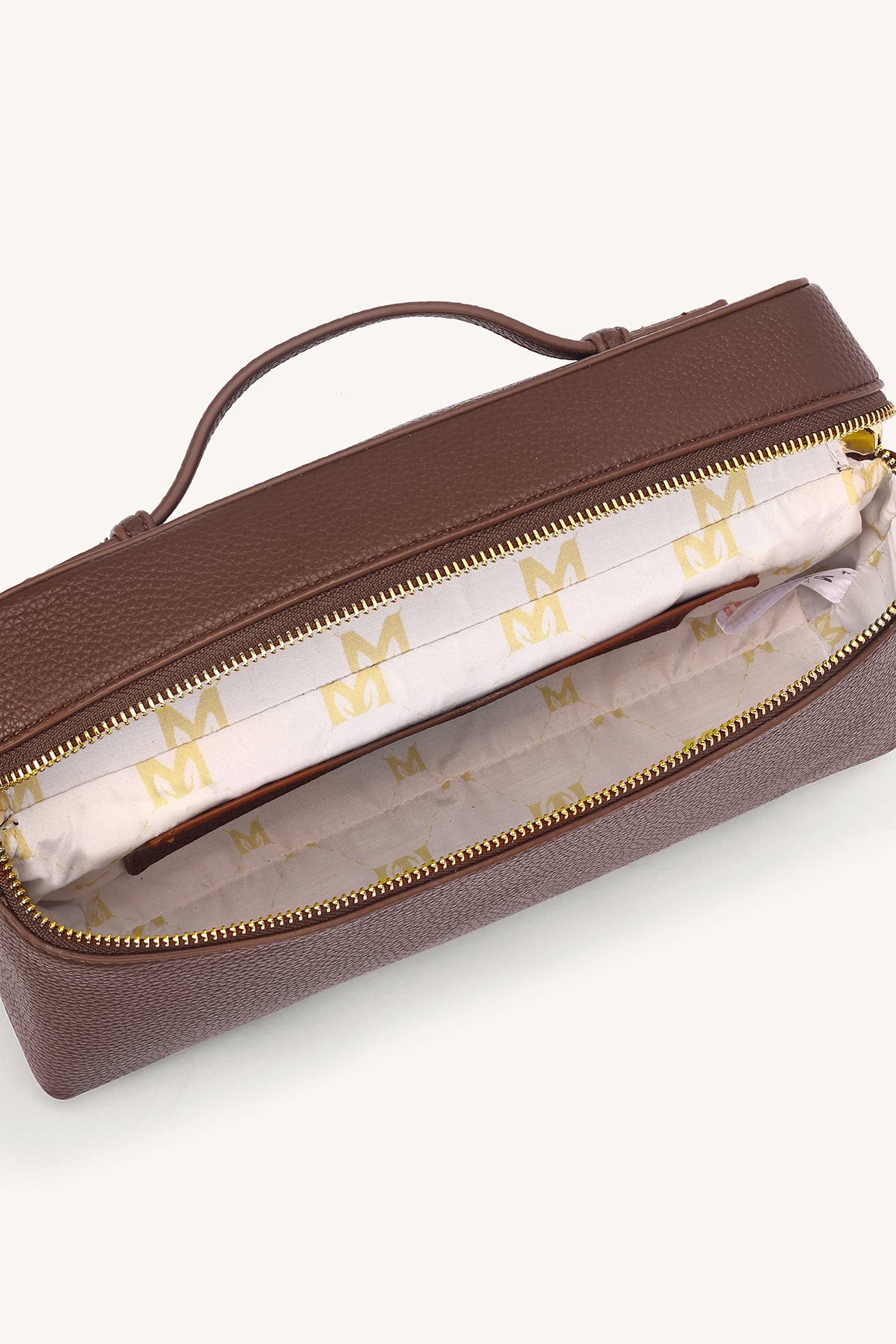 Brown handbag with gold zipper and 'M' logo on a white background