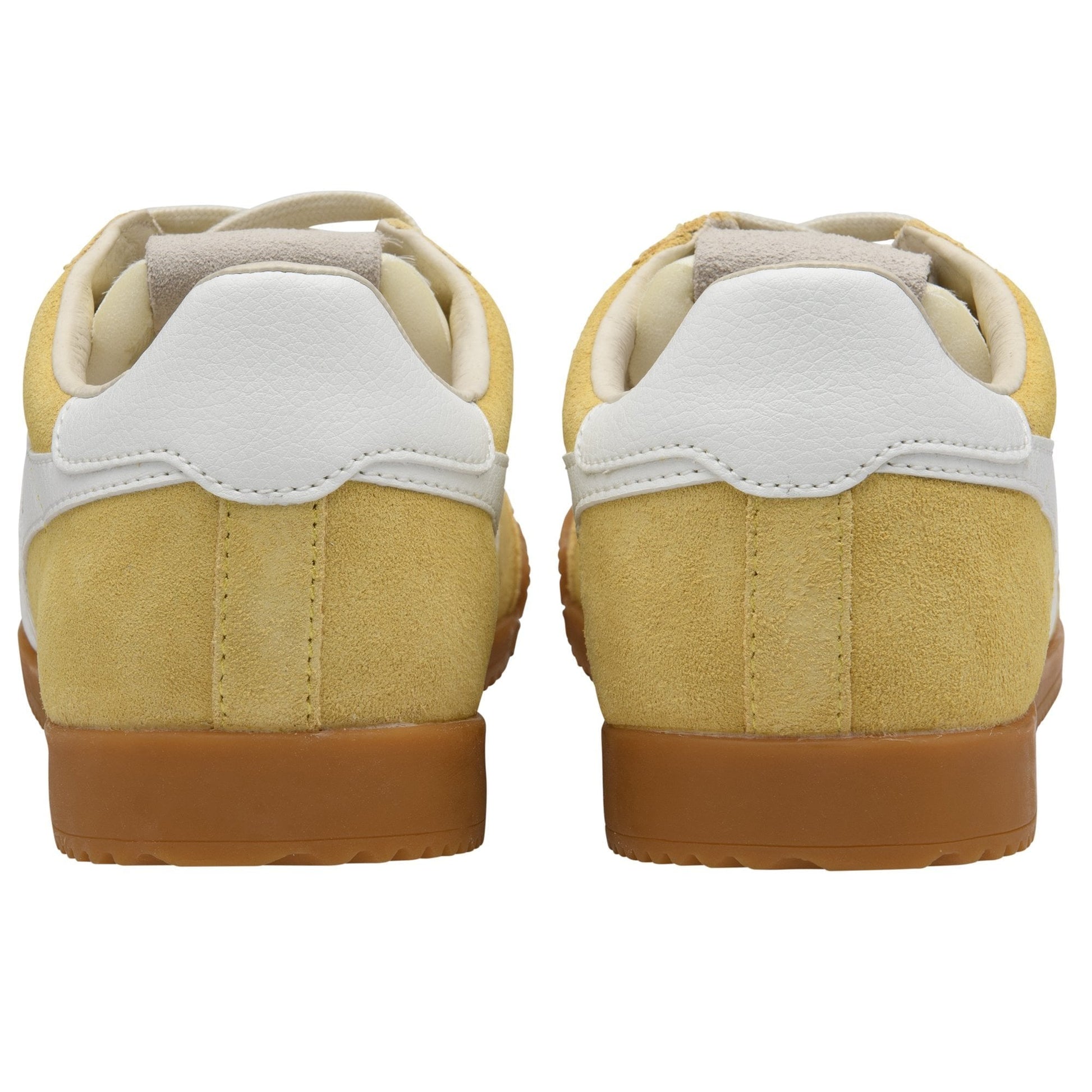 Pair of yellow sneakers with white soles on a white background