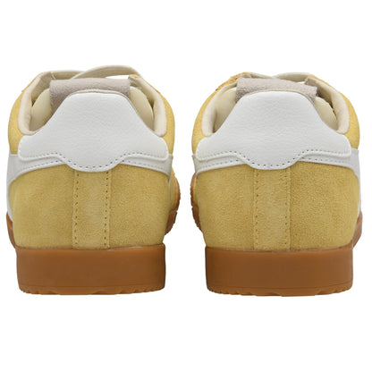 Pair of yellow sneakers with white soles on a white background
