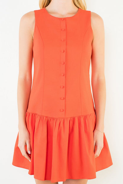 Orange sleeveless dress with buttons on a white background
