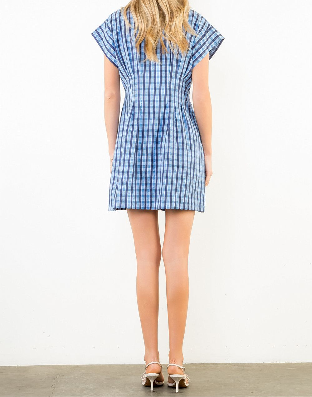 woman wearing plaid mini dress