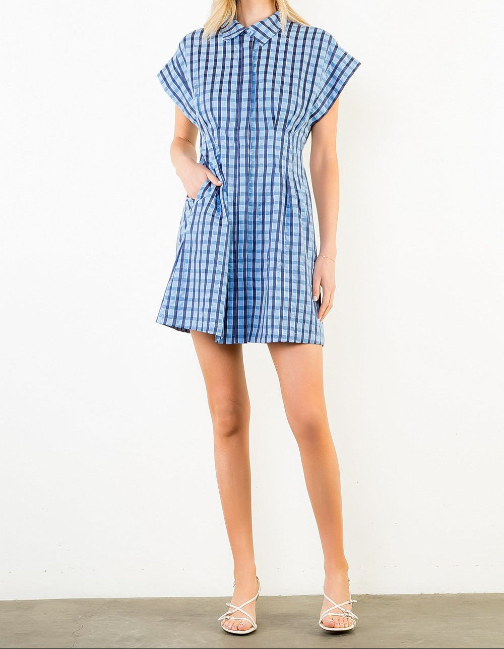 woman wearing plaid mini dress