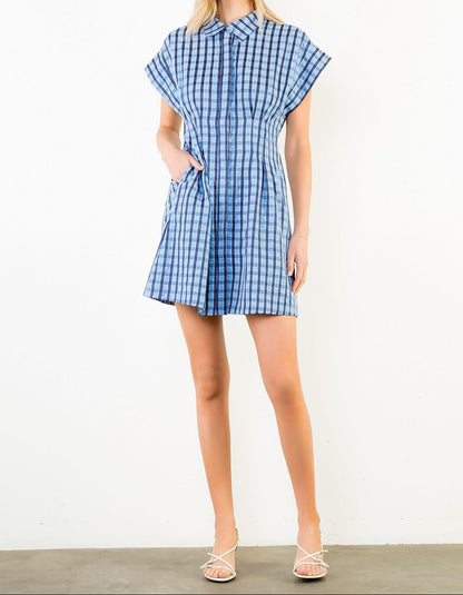 woman wearing plaid mini dress