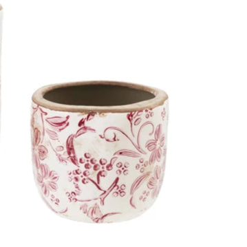 Two ceramic pots with floral patterns on a white background